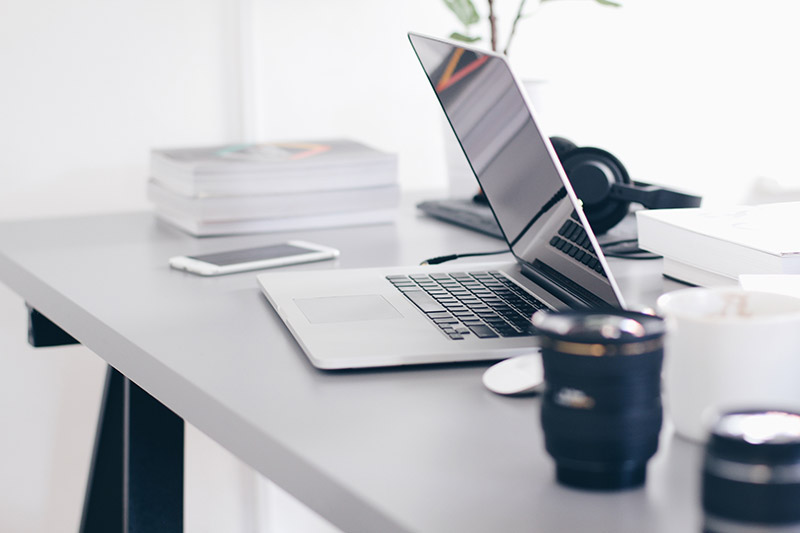 laptop on white desk